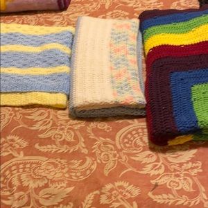 Three knit baby blankets